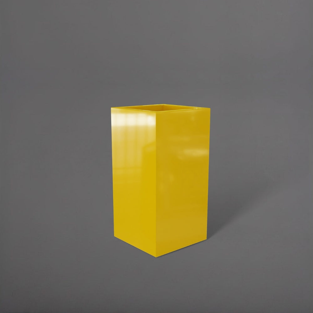 Hollywood Corner Fiberglass Planter in gloss saffron against gray background.