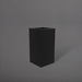 Hollywood Corner Fiberglass Planter in matte black against gray background.