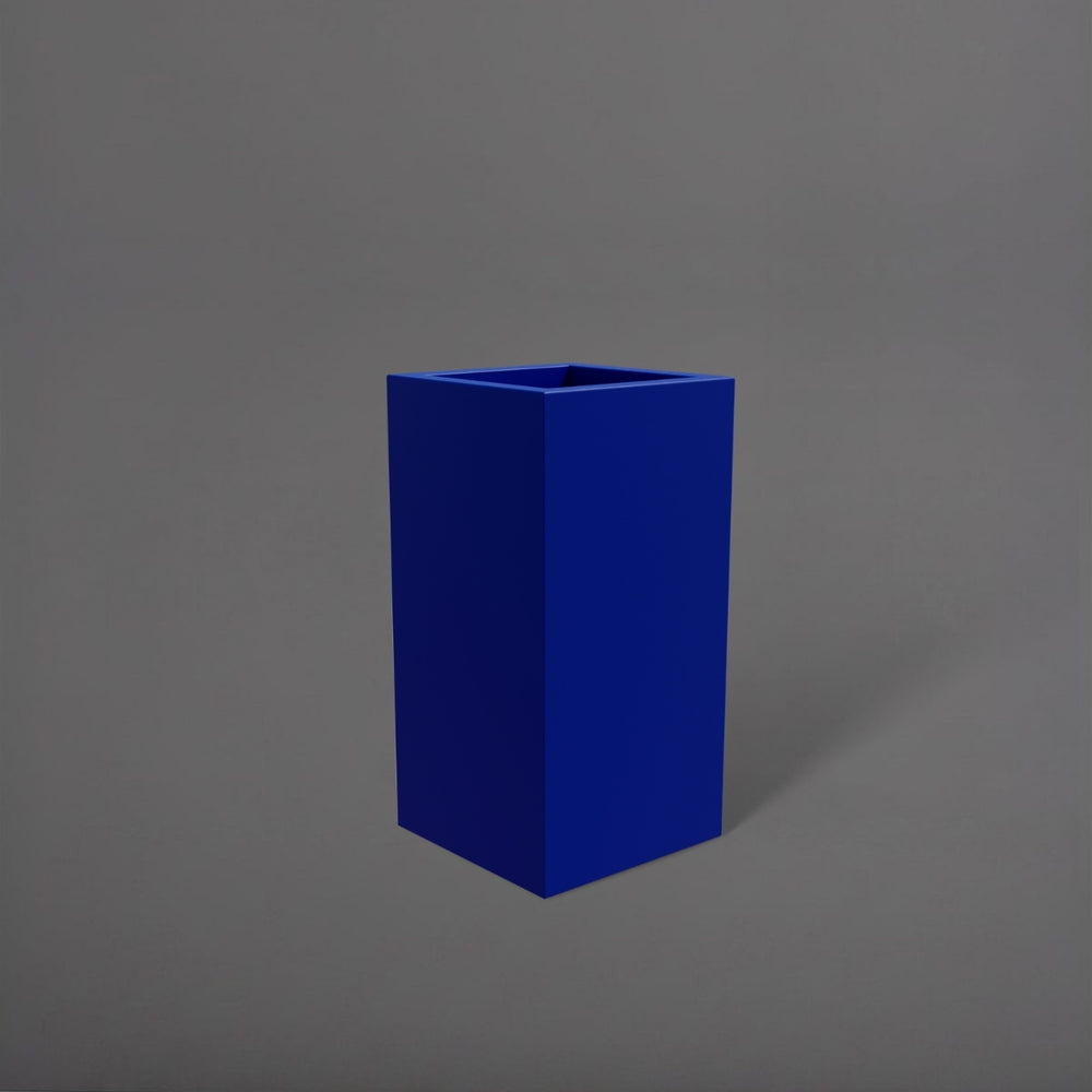 Hollywood Corner Fiberglass Planter in matte cobalt blue against gray background.
