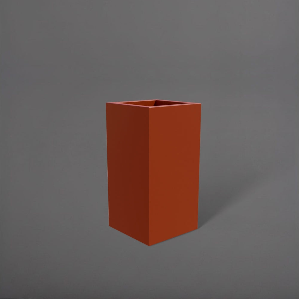 Hollywood Corner Fiberglass Planter in matte terra cotta against gray background.