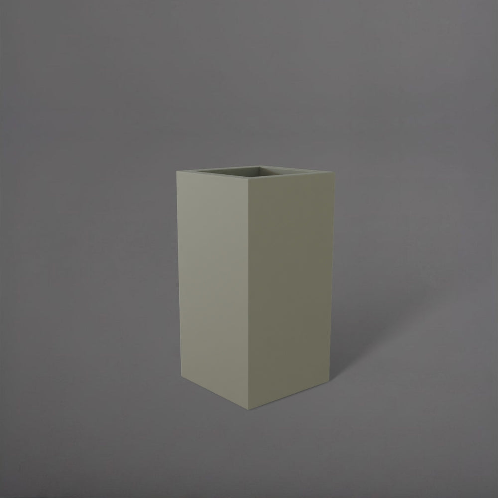 Hollywood Corner Fiberglass Planter in satin beige against gray background.