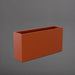 Hollywood Rectangle Fiberglass Planter in matte terra cotta against gray background.