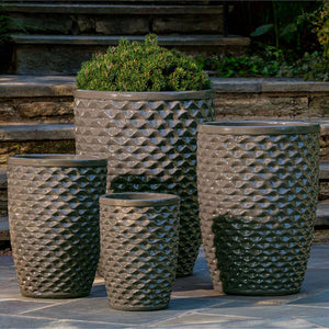 Honeycomb Planter, Tall - Fog - S/4 filled with plants against concrete stairs
