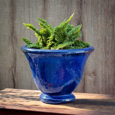 Jacqueline Urn Planter - Riviera Blue - S/1 on table filled with plants