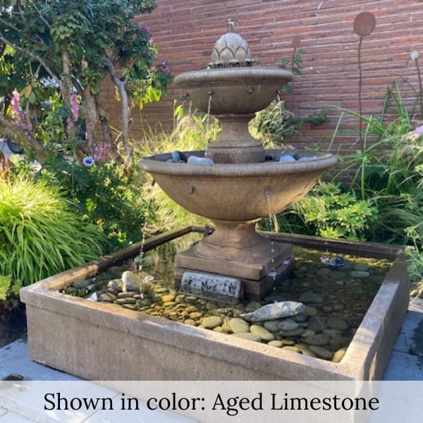 La Mirande Fountain n action in the lush garden oasis.