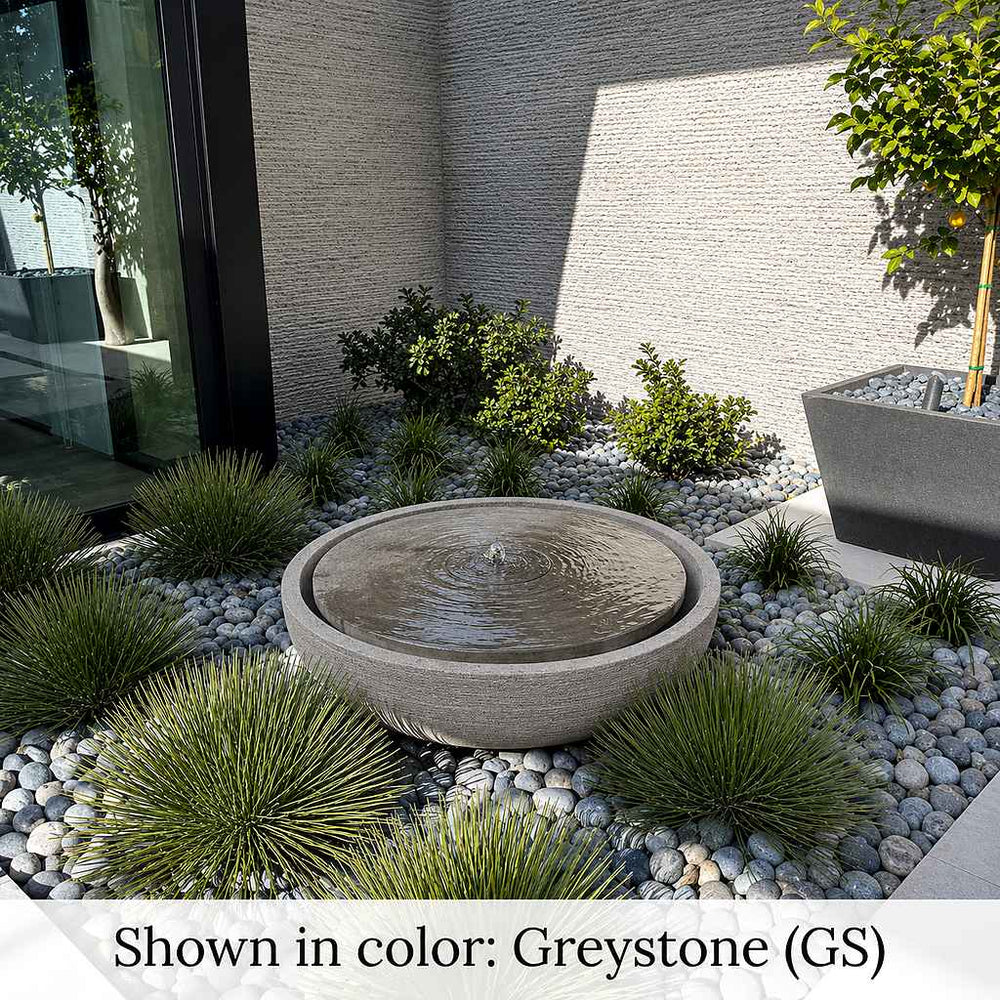 Large Girona modern outdoor water fountain with concrete bowl design in backyard rock garden.