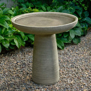Latham Birdbath on gravel in the backyard.