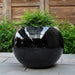 Le Monde Planter on concrete filled with plants.