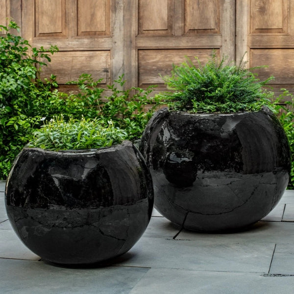 Le Monde Planter shown with different size planter filled with plants.