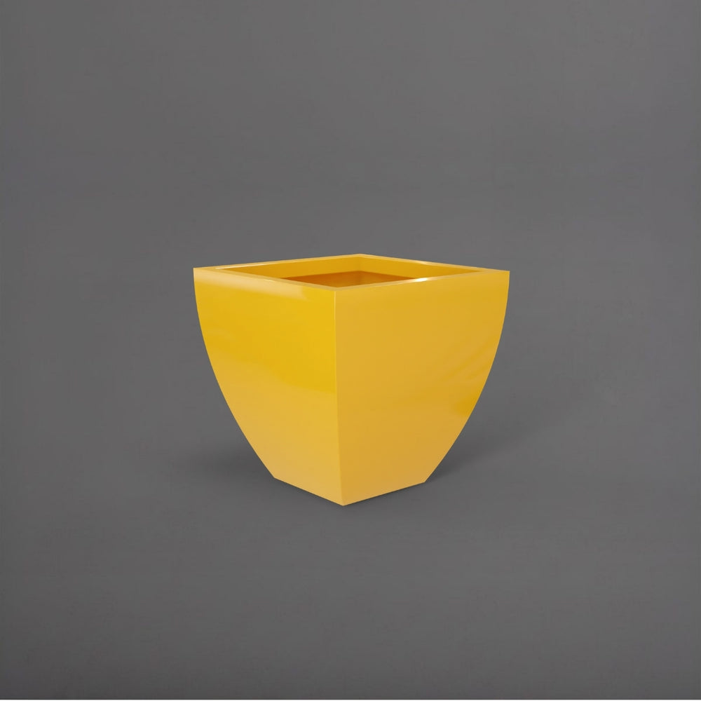Lima Square Tapered Fiberglass Planter in gloss saffron against gray background.