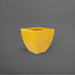 Lima Square Tapered Fiberglass Planter in gloss saffron against gray background.