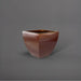 Lima Square Tapered Fiberglass Planter in metallic bronze against gray background.