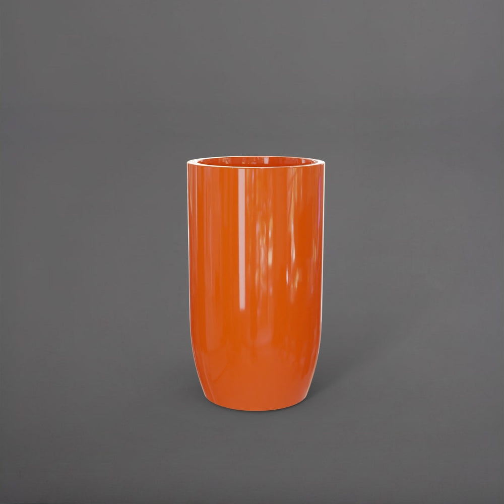 Lisbon Tall Round Tapered Fiberglass Planter in gloss tangerine against gray background.
