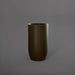 Lisbon Tall Round Tapered Fiberglass Planter in matte bronze against gray background.