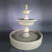 Malibu Two Tier Pond Fountain in action against gray  background.