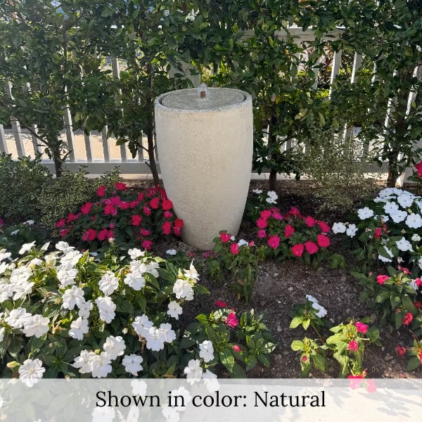 Manzanita Fountain in action surrounded with flowers.