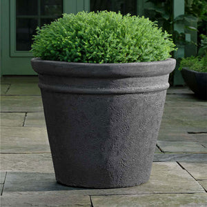 Marchand Planter - Volcanic Coral - S/3 on concrete filled with plants