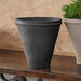 Matera Planter - Charcoal on table beside planter filled with plants