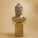 Meditation Buddha Fountain, Tall against brown background.