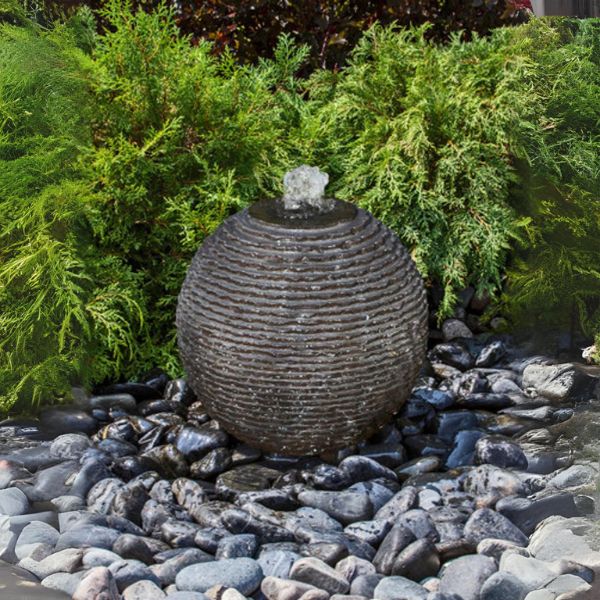 Medium Ribbed Black Sphere Fountain Kit on gravel in action