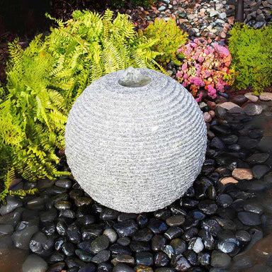 Medium Ribbed Sphere Granite Fountain Kit on black peebles in action