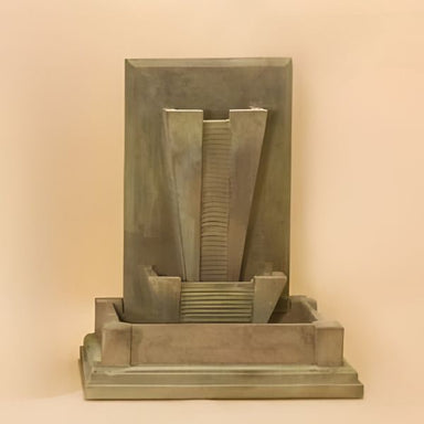 Metro Wall Fountain against brown background.