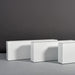 Miami Rectangle Fiberglass Planter on concrete shown with different sizes.