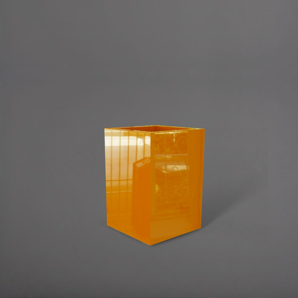 Miami Short Corner Fiberglass Planter in gloss tangerine against gray background.
