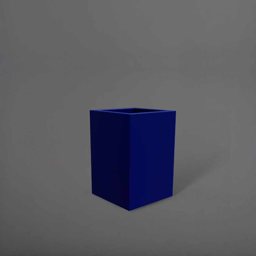 Miami Short Corner Fiberglass Planter in matte cobalt blue against gray background.