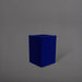 Miami Short Corner Fiberglass Planter in matte cobalt blue against gray background.
