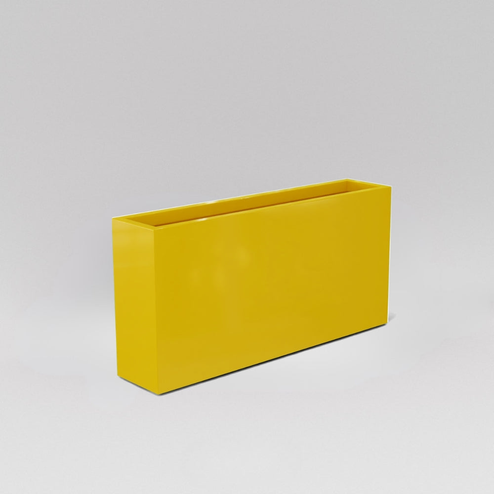 Milano Narrow Rectangle Planter in gloss saffron against gray background.