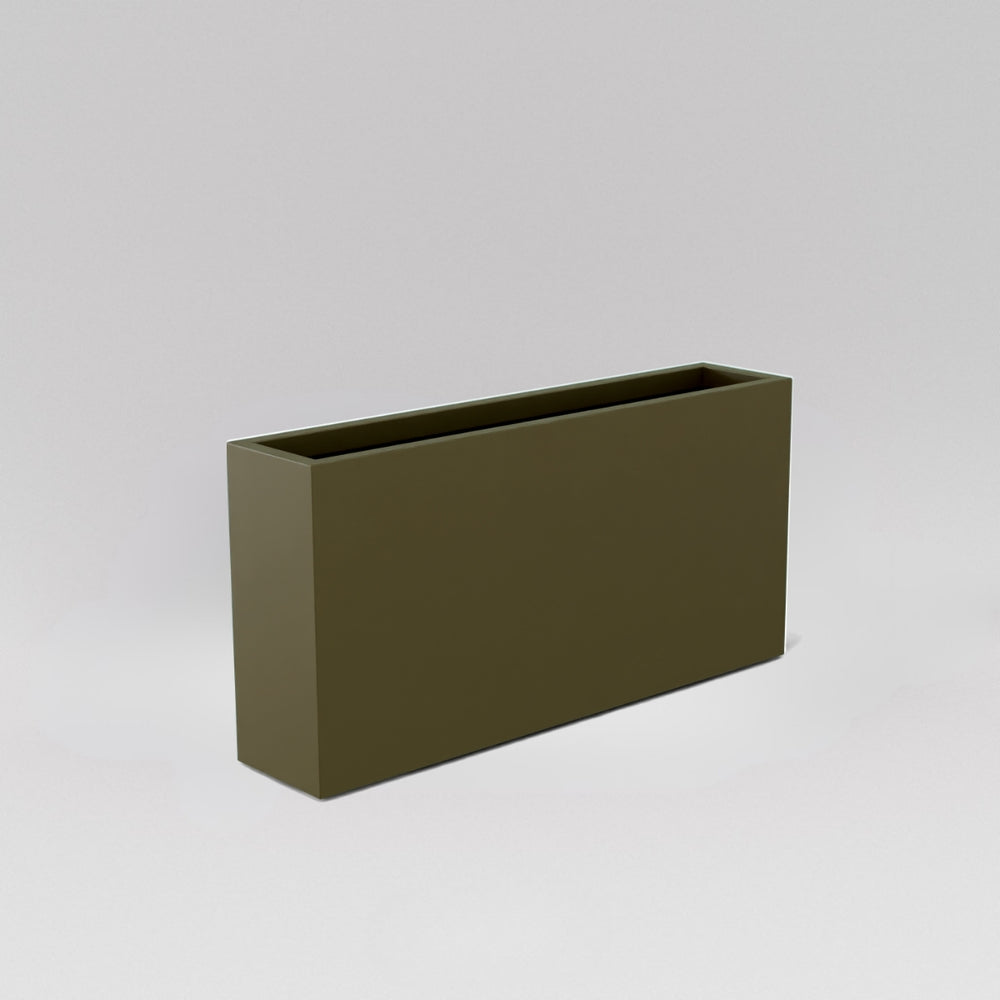 Milano Narrow Rectangle Planter in matte bronze against gray background.