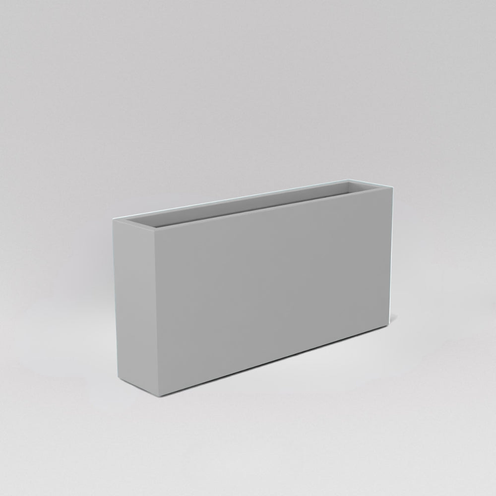 Milano Narrow Rectangle Planter in matte cement grey against gray background.