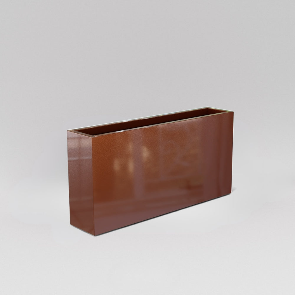 Milano Narrow Rectangle Planter in metallic bronze against gray background.