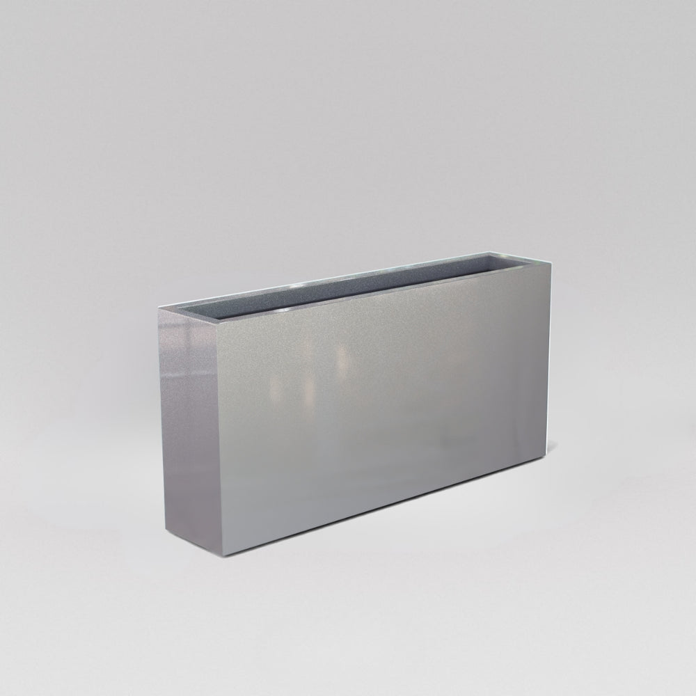 Milano Narrow Rectangle Planter in metallic silver against gray background.