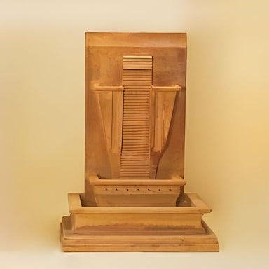 Moderna Wall Fountain against brown background.