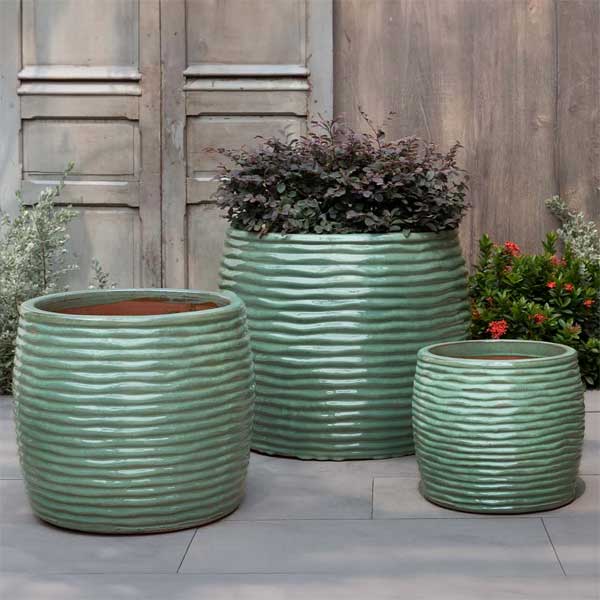 Montauk Planter, Tall - Sea Green - S/3 on concrete filled with plants