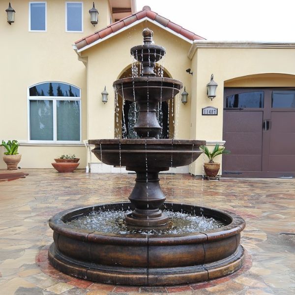 Montefalco Three Tier Pond Fountain in action in front of the house entrance.