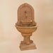 Montefalco Wall Fountain for Rustic Spout against brown background.