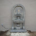 Monterosso Wall Fountain in action against concrete wall.