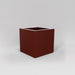 Montroy Cube Fiberglass Planter in matte terra cotta against gray background.