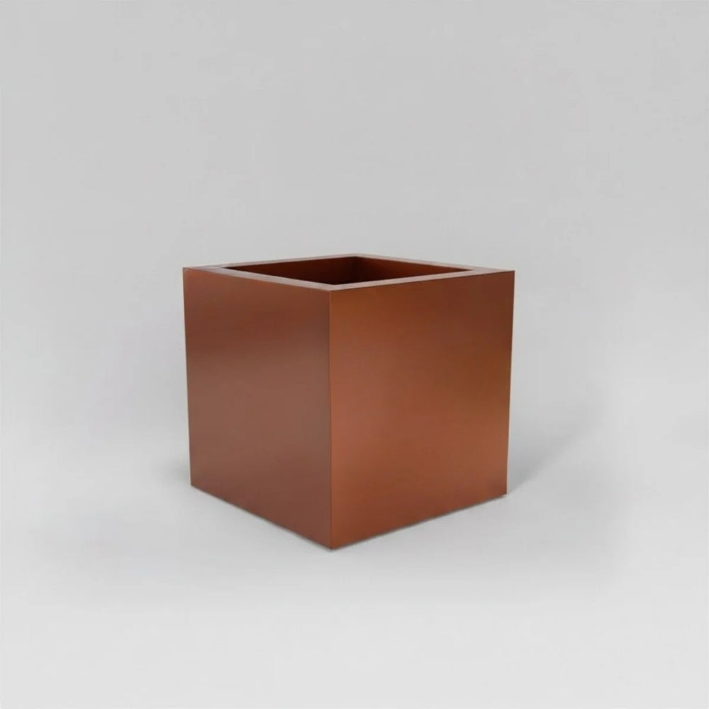 Montroy Cube Fiberglass Planter in  metallic bronze against gray background.