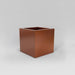 Montroy Cube Fiberglass Planter in  metallic bronze against gray background.