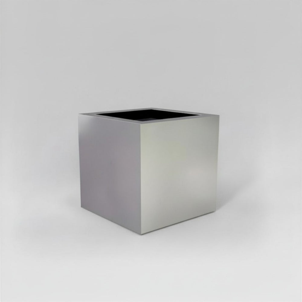 Montroy Cube Fiberglass Planter in  metallic silver against gray background.