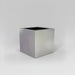 Montroy Cube Fiberglass Planter in  metallic silver against gray background.