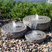 Natural Bowl with swirl fountains, medium on mixed pebbles in action.