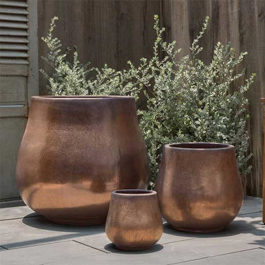 Nimbus Planter - Bronze - S/3 on concrete in the backyard