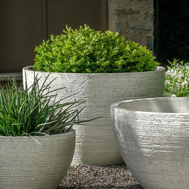 Nori Bowl Planter, Large on gravel filled with plants.