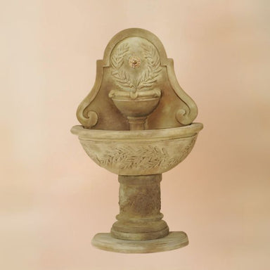 Oliva Wall Fountain for Spout against brown background.