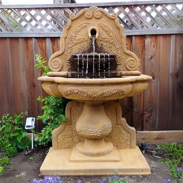 Olive Grove Wall Fountain in action in the backyard.